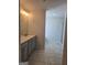 Bathroom featuring a vanity with a single sink, modern fixtures, and tiled flooring at 1455 Weeping Tree Cir, Auburn, GA 30011