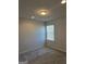 Bedroom with carpet, neutral walls, recessed lighting, and window at 1455 Weeping Tree Cir, Auburn, GA 30011