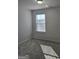 Bedroom with carpet, neutral walls, and window at 1455 Weeping Tree Cir, Auburn, GA 30011