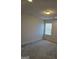 Bedroom with carpet, neutral walls, recessed lighting, and window at 1455 Weeping Tree Cir, Auburn, GA 30011