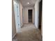 Hallway with carpet and doors leading to other rooms at 1455 Weeping Tree Cir, Auburn, GA 30011