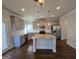 Spacious kitchen featuring stainless steel appliances, a large island, and ample counter space at 1455 Weeping Tree Cir, Auburn, GA 30011