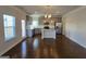 Open-concept kitchen and dining area with stainless steel appliances and a large center island at 1455 Weeping Tree Cir, Auburn, GA 30011