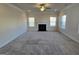 Bright living room featuring a fireplace, recessed lighting, and large windows at 1455 Weeping Tree Cir, Auburn, GA 30011