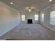 Spacious living room features a fireplace, carpet flooring, and multiple windows for lots of natural light at 1455 Weeping Tree Cir, Auburn, GA 30011