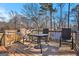 Back deck with table and chairs, perfect for enjoying the outdoors at 635 Cowan Rd, Covington, GA 30016