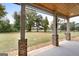 Covered patio overlooking a beautifully landscaped yard at 870 N Bethany Rd, Mcdonough, GA 30252