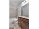 Bathroom with granite countertop and tiled shower at 870 N Bethany Rd, Mcdonough, GA 30252