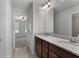 Double vanity bathroom with granite countertops and mirror at 870 N Bethany Rd, Mcdonough, GA 30252
