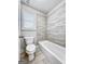 Clean bathroom with a bathtub and tile surround at 870 N Bethany Rd, Mcdonough, GA 30252