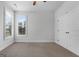Spacious bedroom with carpeted floors and large windows at 870 N Bethany Rd, Mcdonough, GA 30252