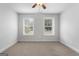 Spacious bedroom with neutral carpeting and two windows at 870 N Bethany Rd, Mcdonough, GA 30252