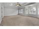 Bright bedroom with bay windows and ceiling fan at 870 N Bethany Rd, Mcdonough, GA 30252