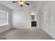 Bright bedroom with ceiling fan and access to bathroom at 870 N Bethany Rd, Mcdonough, GA 30252