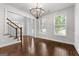 Elegant dining room with hardwood floors and a large chandelier at 870 N Bethany Rd, Mcdonough, GA 30252