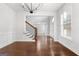 Spacious dining room features hardwood floors and a chandelier at 870 N Bethany Rd, Mcdonough, GA 30252