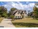 Brick house with two-car driveway and landscaped lawn at 870 N Bethany Rd, Mcdonough, GA 30252