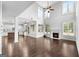 Two-story great room with hardwood floors, fireplace, and abundant natural light at 870 N Bethany Rd, Mcdonough, GA 30252