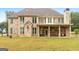 Brick house with covered patio and large backyard at 870 N Bethany Rd, Mcdonough, GA 30252
