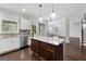 Modern kitchen with island, stainless steel appliances, and granite countertops at 870 N Bethany Rd, Mcdonough, GA 30252