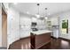 Island kitchen with white cabinets, granite countertops and stainless steel appliances at 870 N Bethany Rd, Mcdonough, GA 30252
