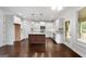 Modern kitchen with island, stainless steel appliances, and hardwood floors at 870 N Bethany Rd, Mcdonough, GA 30252