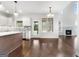 Bright kitchen features an island, stainless steel appliances, and hardwood floors at 870 N Bethany Rd, Mcdonough, GA 30252