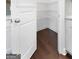 Walk-in pantry with wire shelving and hardwood floor at 870 N Bethany Rd, Mcdonough, GA 30252
