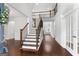 Stunning staircase with wrought iron railing and hardwood floors at 870 N Bethany Rd, Mcdonough, GA 30252