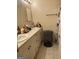 Bathroom featuring double sink vanity, wall mirror, and shower curtain at 241 E Ash St, Social Circle, GA 30025