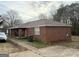 Brick home with a carport and a large yard at 241 E Ash St, Social Circle, GA 30025