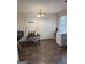 A kitchen area includes a standing freezer, extra storage, and overhead lighting at 241 E Ash St, Social Circle, GA 30025