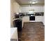 A kitchen with white cabinets and tile floors at 241 E Ash St, Social Circle, GA 30025