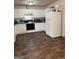 Spacious kitchen with white cabinets and tile flooring at 241 E Ash St, Social Circle, GA 30025