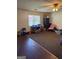 Spacious living room with neutral carpet, ceiling fan, and natural light at 241 E Ash St, Social Circle, GA 30025
