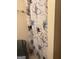 The corner of a bathroom featuring a patterned shower curtain and a trash bin at 241 E Ash St, Social Circle, GA 30025