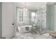 Luxurious bathroom with soaking tub, marble shower, and dual vanities at 170 Newhaven Dr, Fayetteville, GA 30215