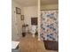 Full bathroom featuring a toilet, shower curtain, and tile flooring at 65 Waters Edge Ln, Covington, GA 30014
