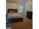 Comfortable bedroom with a large bed, dresser, and ample natural light at 65 Waters Edge Ln, Covington, GA 30014