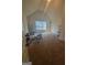 Large bonus room with carpet, a desk, and entertainment area at 65 Waters Edge Ln, Covington, GA 30014