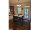 Cozy dining area featuring a table with seating for four and an access door to the outside at 65 Waters Edge Ln, Covington, GA 30014