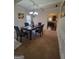 Formal dining room with a view into the kitchen, offering ample space for entertaining at 65 Waters Edge Ln, Covington, GA 30014