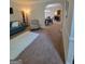 Cozy living room featuring plush carpeting and a comfortable seating area at 65 Waters Edge Ln, Covington, GA 30014