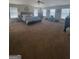 Spacious main bedroom features large windows, ceiling fan, and ample natural light at 65 Waters Edge Ln, Covington, GA 30014