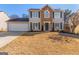 Two-story house with stone accents and a large front yard at 13 Cheyenne Dr, Stockbridge, GA 30281