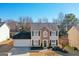 Two-story house with stone accents and a landscaped yard at 13 Cheyenne Dr, Stockbridge, GA 30281