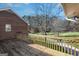 Wooden back deck overlooking large backyard, perfect for outdoor relaxing and entertainment at 606 Ginger Cake Rd, Fayetteville, GA 30214