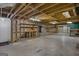 Unfinished basement space with exposed ceiling, concrete floor, and wooden frame; awaiting personalization at 606 Ginger Cake Rd, Fayetteville, GA 30214