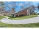 Brick home with circular driveway and landscaping at 606 Ginger Cake Rd, Fayetteville, GA 30214