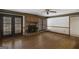 Living room with a brick fireplace and hardwood floors at 606 Ginger Cake Rd, Fayetteville, GA 30214